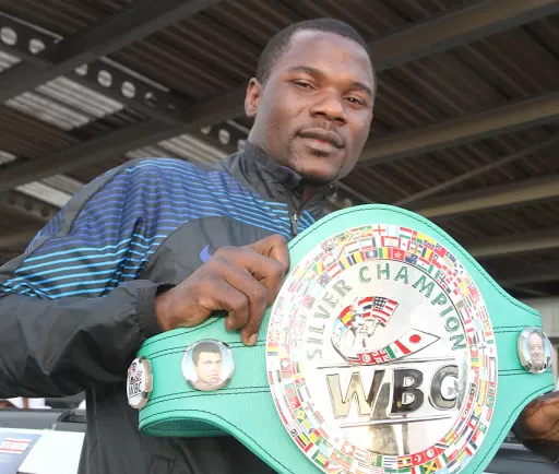Charles Manyuchi holding the WBC silver champion belt