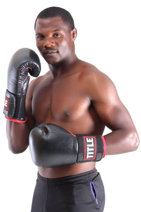 Charles Manyuchi in a fighting stance with black gloves