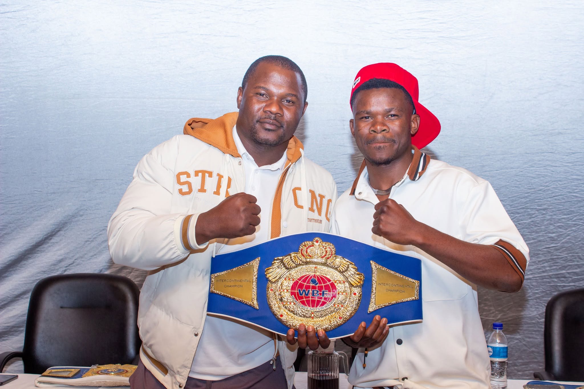 Charles Manyuchi presenting the WBF intercontinental belt