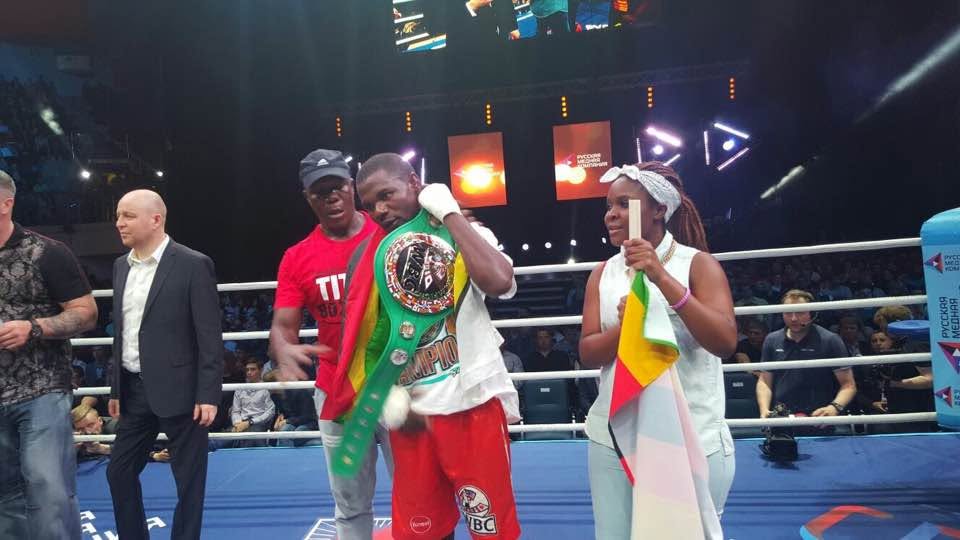 Charles Manyuchi in the corner with his belt and the Zimbabwean flag on fight night