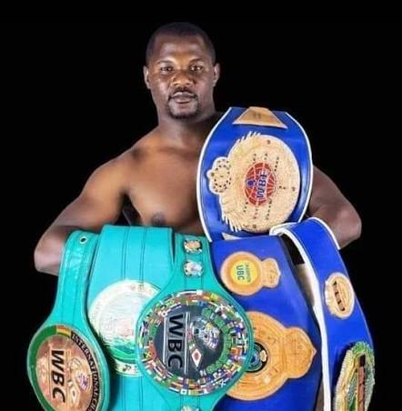 Charles Manyuchi with his collection of championship belts