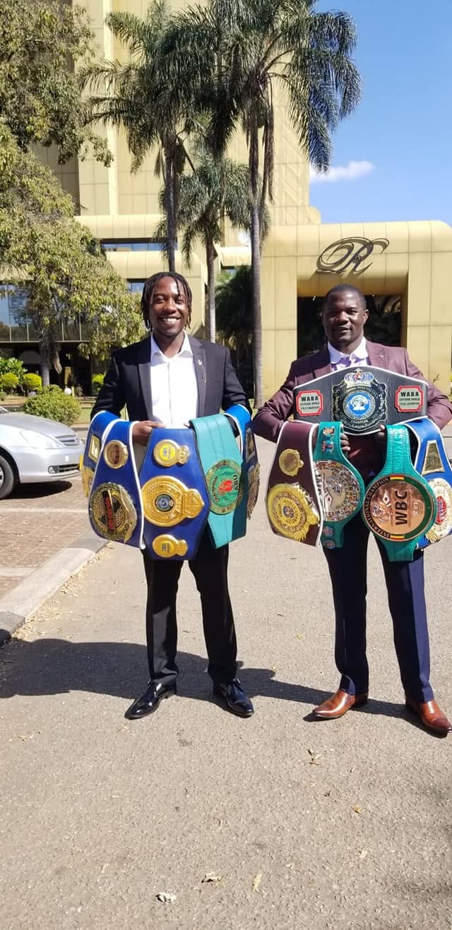 Charles Manyuchi passing championship belts to the next generation